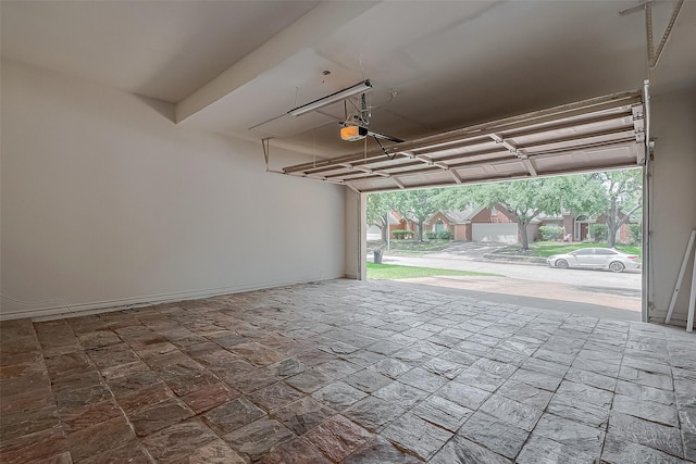 10310 Sable Trail Ln, Houston, TX 77064 - garage featuring a garage door opener and baseboards