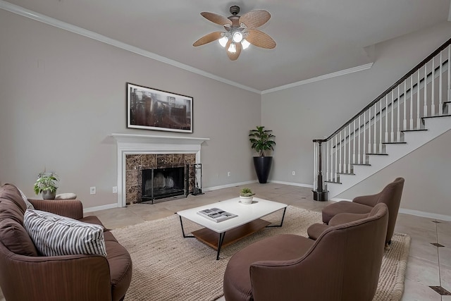 10310 Sable Trail Ln, Houston, TX 77064 - living room featuring tile patterned flooring, stairway, a ceiling fan, ornamental molding, and a fireplace