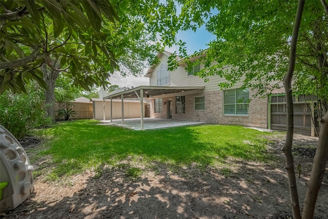 10310 Sable Trail Ln, Houston, TX 77064 - rear view of property featuring brick siding and a patio area