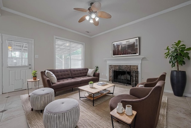 10310 Sable Trail Ln, Houston, TX 77064 - living area featuring ornamental molding, a high end fireplace, a ceiling fan, light tile patterned floors, and baseboards