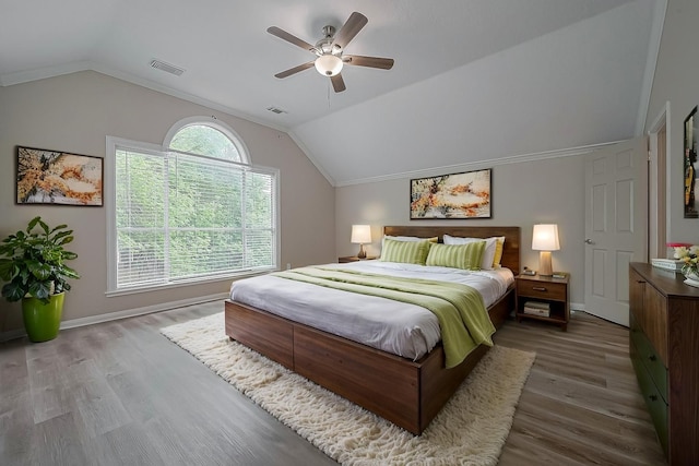 10310 Sable Trail Ln, Houston, TX 77064 - bedroom featuring lofted ceiling, wood finished floors, a ceiling fan, and baseboards