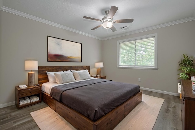 10310 Sable Trail Ln, Houston, TX 77064 - bedroom featuring baseboards, wood finished floors, crown molding, and a ceiling fan