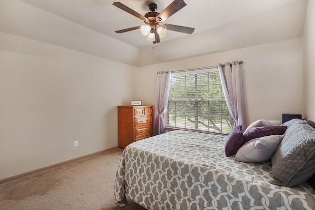 carpeted bedroom with baseboards and ceiling fan