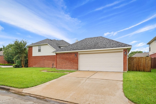 view of front of house featuring brick siding, driveway, fence, and a front yard