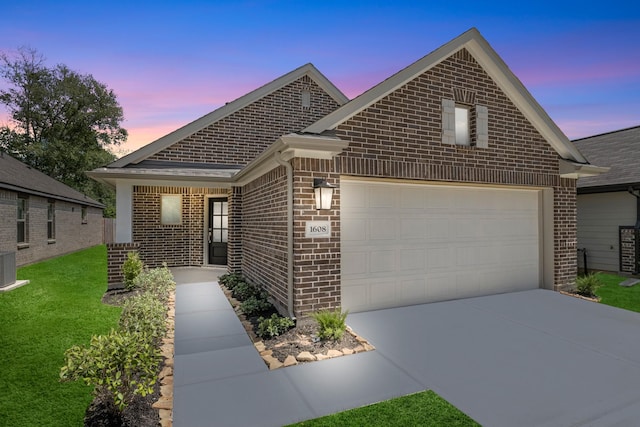 view of front of property featuring a garage, brick siding, cooling unit, a front lawn, and concrete driveway