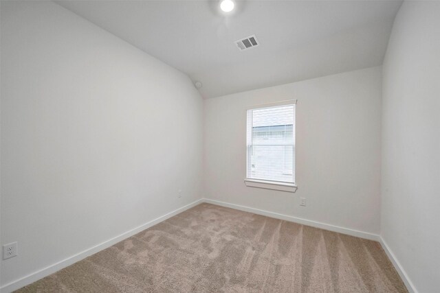 1650 Portia Ln, Conroe, TX 77301 - carpeted empty room featuring visible vents, baseboards, and vaulted ceiling