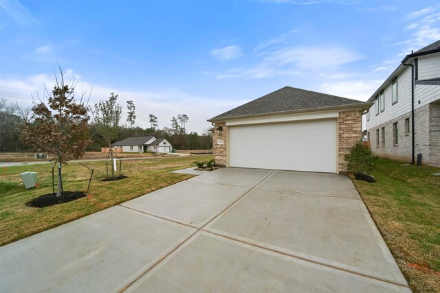 1730 Portia Ln, Conroe, TX 77301 - view of side of home with a yard, brick siding, roof with shingles, and a garage