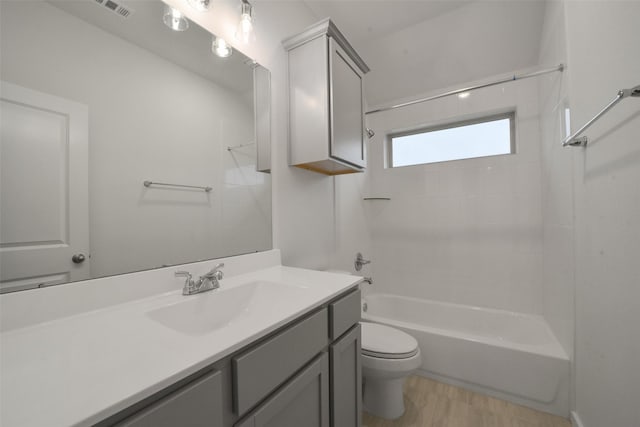 1710 Portia Ln, Conroe, TX 77301 - bathroom with toilet, visible vents, shower / bathing tub combination, and vanity