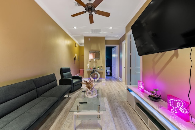 12832 Willow Centre Dr, Houston, TX 77066 - living area featuring crown molding, a ceiling fan, wood finished floors, and visible vents