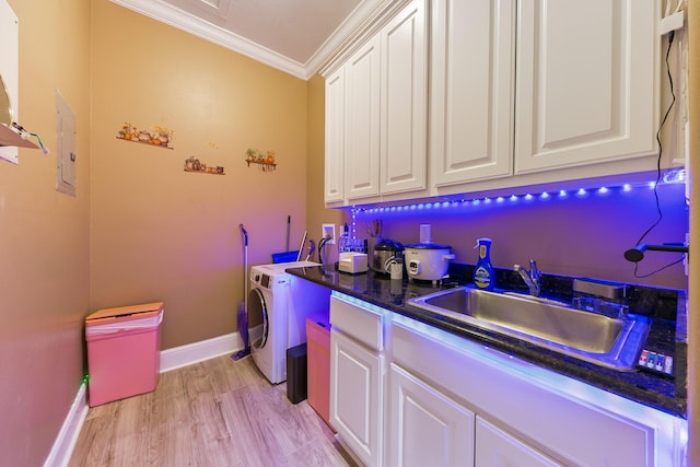 12832 Willow Centre Dr, Houston, TX 77066 - clothes washing area with crown molding, cabinet space, a sink, washer / clothes dryer, and baseboards
