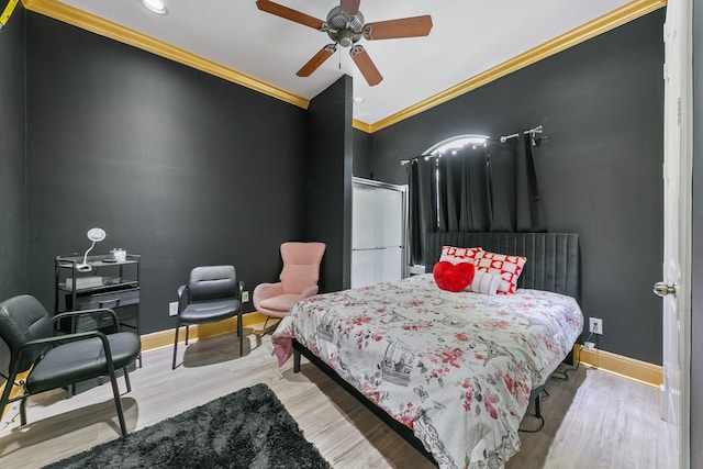 12832 Willow Centre Dr, Houston, TX 77066 - bedroom featuring crown molding, baseboards, ceiling fan, and wood finished floors