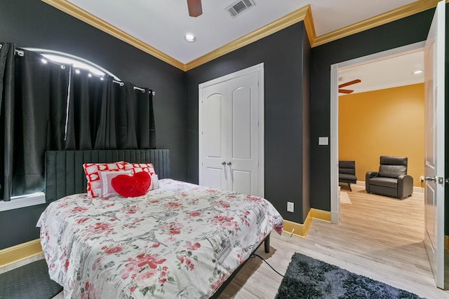 12832 Willow Centre Dr, Houston, TX 77066 - bedroom with baseboards, ornamental molding, wood finished floors, and visible vents