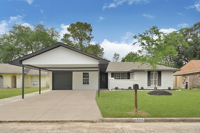 ranch-style home featuring a front lawn, brick siding, an attached garage, driveway, and a carport