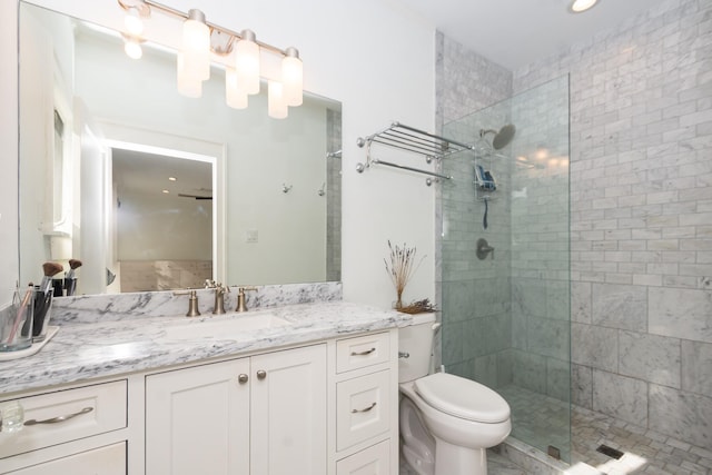 full bathroom with recessed lighting, vanity, toilet, and tiled shower