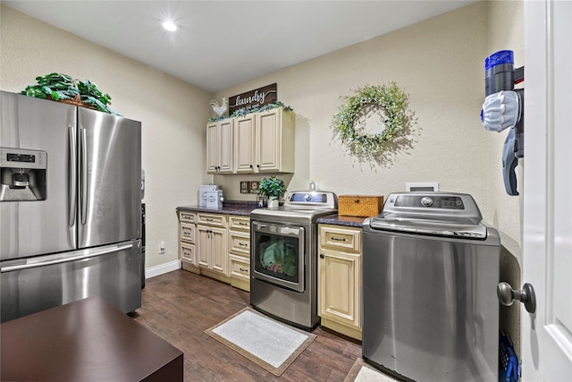 kitchen featuring cream cabinets, dark wood-style flooring, dark countertops, and stainless steel fridge with ice dispenser
