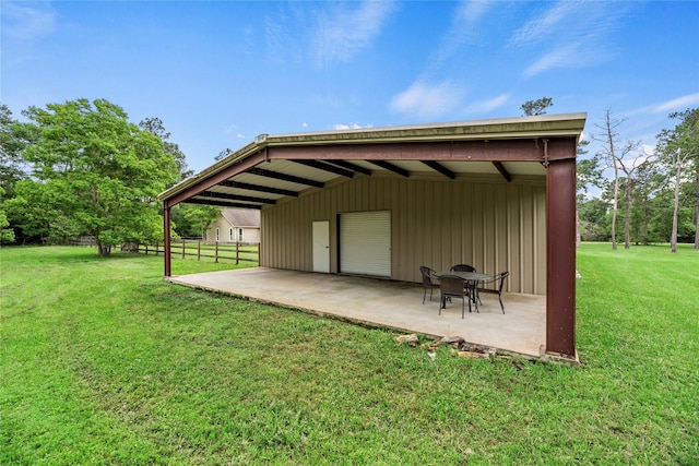 view of outbuilding with fence and an outdoor structure