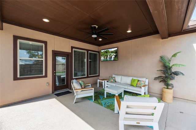 view of patio with ceiling fan and an outdoor hangout area