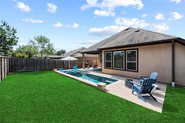 rear view of property with a lawn, a patio area, a fenced in pool, a fenced backyard, and a shingled roof