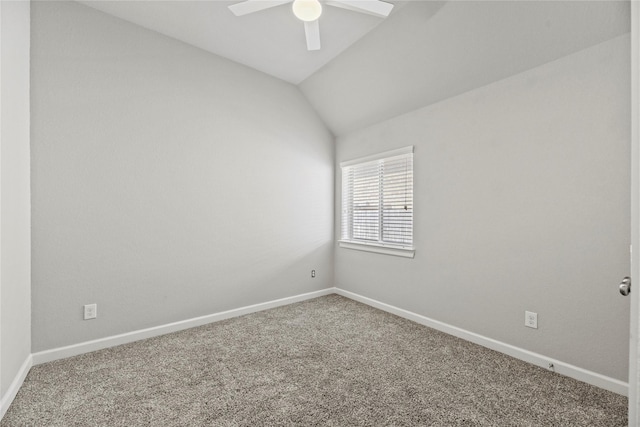 spare room with carpet floors, ceiling fan, baseboards, and lofted ceiling