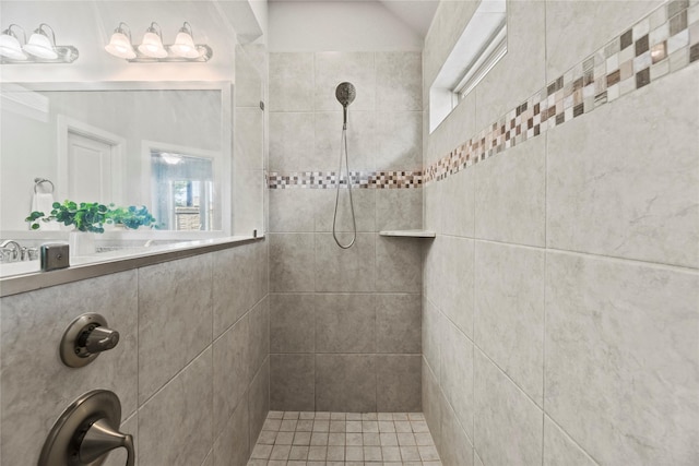 bathroom with tiled shower