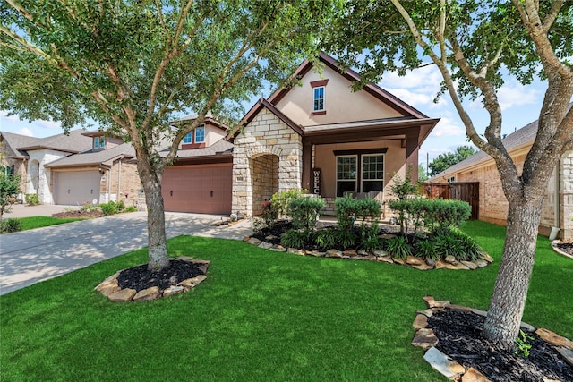 craftsman house featuring a garage, a front lawn, stone siding, stucco siding, and concrete driveway