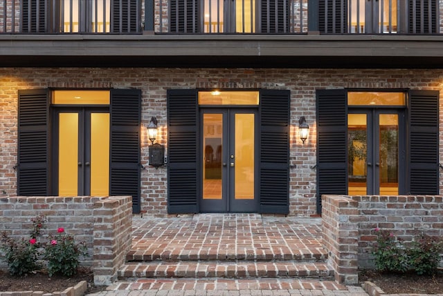 5040 Fieldwood Dr, Houston, TX 77056 - property entrance with covered porch, french doors, and brick siding