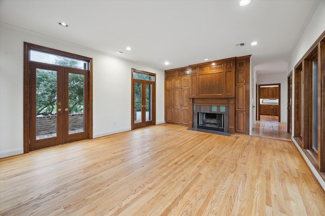 5040 Fieldwood Dr, Houston, TX 77056 - unfurnished living room with light wood-style floors, french doors, baseboards, and recessed lighting