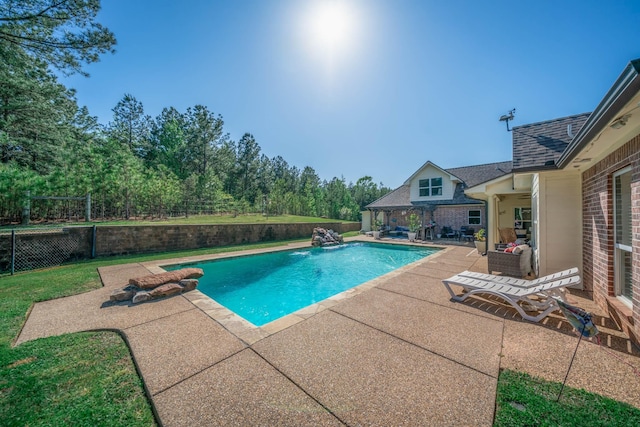 view of pool featuring a patio, fence, and a fenced in pool