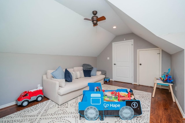 game room featuring baseboards, ceiling fan, vaulted ceiling, and wood finished floors