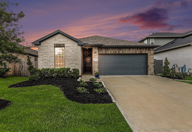 9118 Brixham Dr, Cypress, TX 77433 - view of front facade featuring an attached garage, driveway, stone siding, and a shingled roof