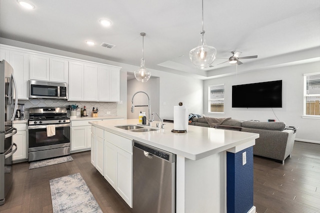 9118 Brixham Dr, Cypress, TX 77433 - kitchen featuring stainless steel appliances, a sink, ceiling fan, dark wood-type flooring, and recessed lighting