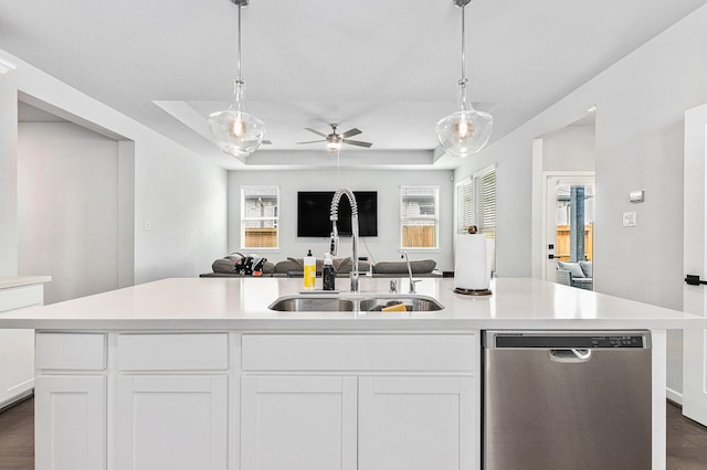9118 Brixham Dr, Cypress, TX 77433 - kitchen with dishwasher, a sink, open floor plan, a ceiling fan, and light countertops