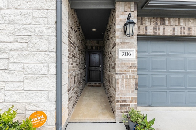 9118 Brixham Dr, Cypress, TX 77433 - view of exterior entry with a garage