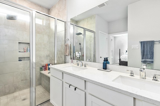 9118 Brixham Dr, Cypress, TX 77433 - bathroom with connected bathroom, a shower stall, and double vanity