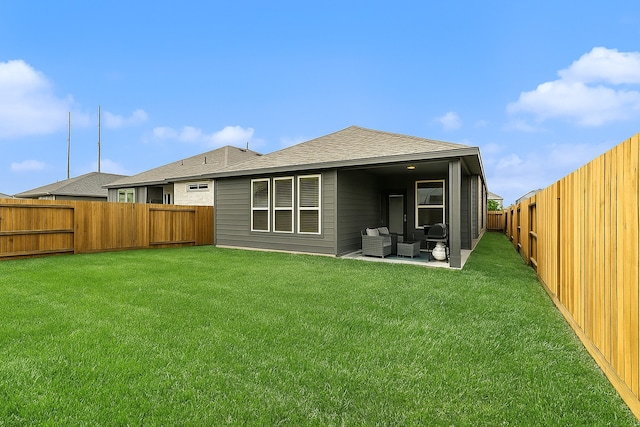 9118 Brixham Dr, Cypress, TX 77433 - back of house featuring outdoor lounge area, roof with shingles, and a patio area