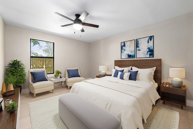 bedroom featuring baseboards, a ceiling fan, and light wood-style flooring