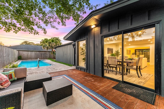 view of swimming pool with a fenced in pool, an outdoor hangout area, a fenced backyard, and a deck