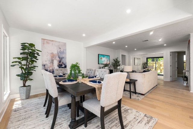 dining area featuring recessed lighting, light wood-style flooring, and baseboards