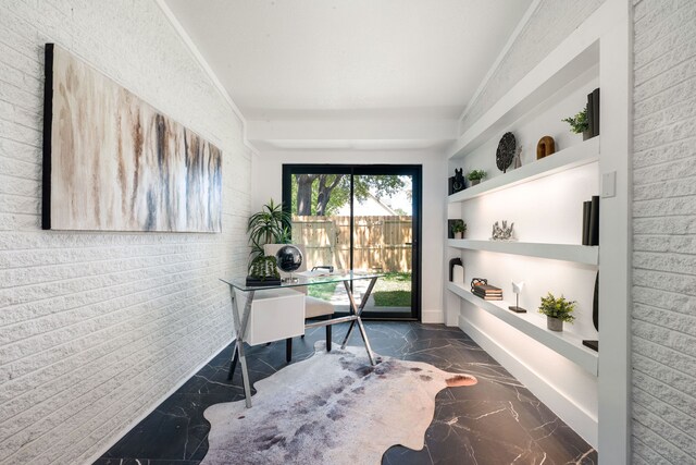 office area with built in shelves and marble finish floor
