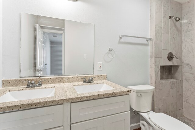 3450 Lydia St, Houston, TX 77021 - bathroom featuring a sink, a tile shower, and toilet