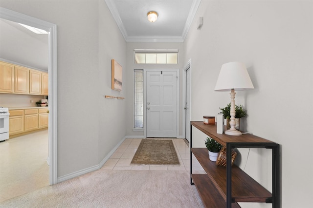 entrance foyer with baseboards, ornamental molding, light tile patterned floors, and light carpet