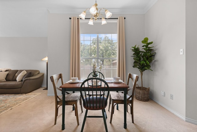 dining space with crown molding, light colored carpet, baseboards, and an inviting chandelier