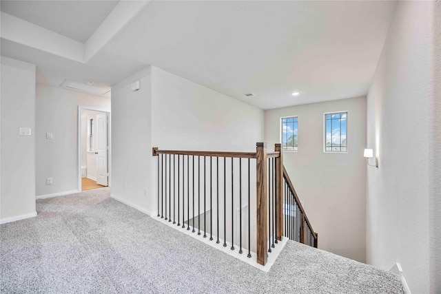 stairway with baseboards, carpet flooring, and visible vents