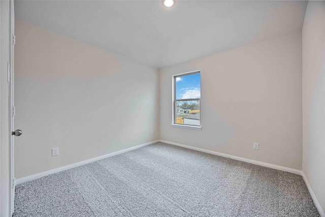 spare room with carpet floors and baseboards