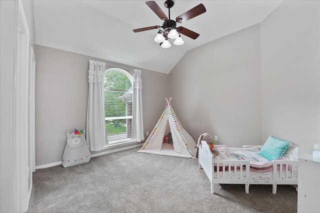 bedroom with baseboards, a ceiling fan, carpet, and vaulted ceiling
