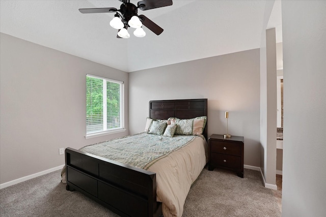 bedroom featuring baseboards, light carpet, and ceiling fan