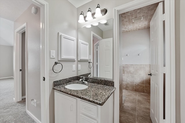 bathroom featuring vanity and visible vents