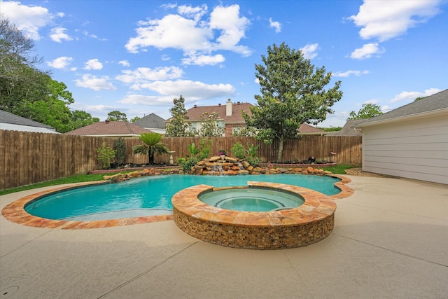 view of pool with a fenced backyard, a patio area, and a pool with connected hot tub