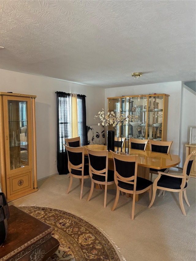18207 Sea Branch Dr, Houston, TX 77084 - dining space featuring light carpet and a textured ceiling