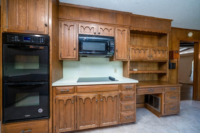 kitchen with light countertops, open shelves, black appliances, and brown cabinetry
